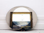 A 1970's French egg shaped mirror