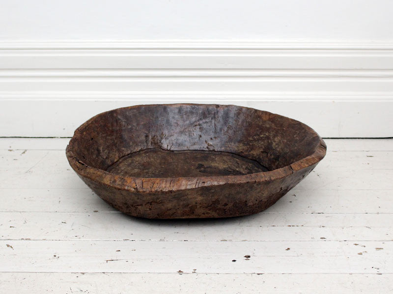 An exceptionally large antique burr elm bowl carved from one piece of wood