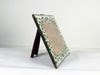 A charming hand painted mirror picture frame