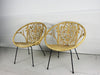 A pair of 1960's bucket rattan chairs with heart shaped design