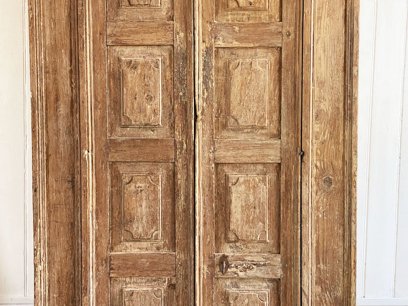 A Late 17th Century Italian Cupboard with Triple Panelled DoorsA Late 17th Century Italian Cupboard with Triple Panelled Doors