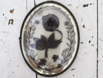 An Antique French Relic in a Domed Frame with Silvered Edging