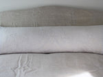 Antique embroidered tulle on linen bolster by Charlotte Casadéjus