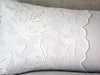 Antique embroidered scalopped tulle on linen bolster by Charlotte Casadéjus