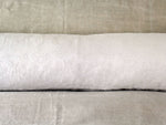An antique linen bolster with Cornely embroidery centre panel by Charlotte Casadéjus