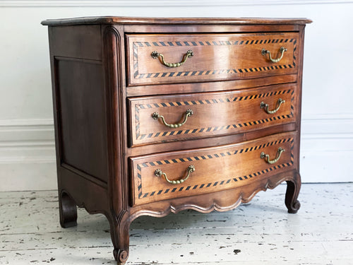 An Antique French Serpentine Fronted Cherry Wood Commode