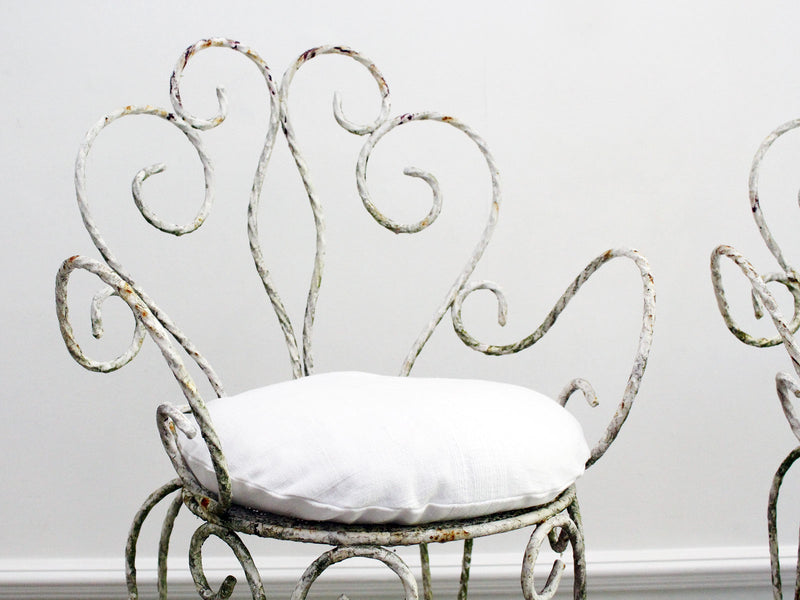 An Elegant Pair of Painted White Wrought Iron Garden Chairs