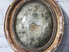 An Antique French White Flower Garland in Gold Domed Glass Frame