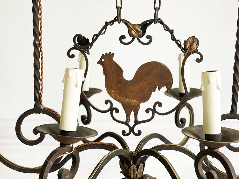 A 1930's French Wrought Iron 8 Arm Chandelier with Cockerel Decoration