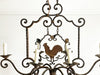 A 1930's French Wrought Iron 8 Arm Chandelier with Cockerel Decoration