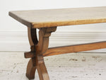 An Antique French Oak Cross Leg Sawbuck Trestle Dining Table