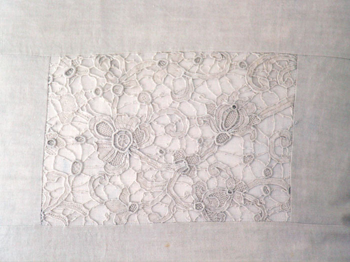 An antique French linen and lace 50cm square cushion