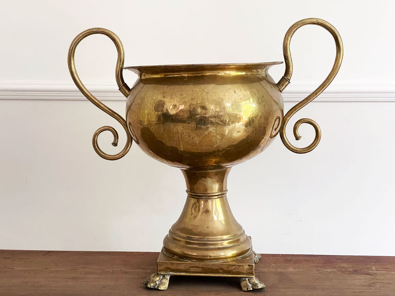 A Large 19th Century Brass Urn with Scrolled Handles and Claw Feet