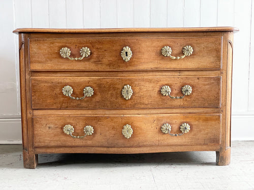 A Louis XV Walnut Serpentine Fronted Commode