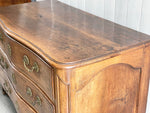 A Louis XV Walnut Serpentine Fronted Commode