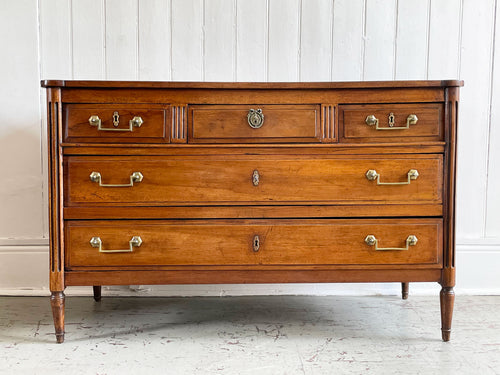 A Louis XVI Walnut Commode with Original Brass Handles