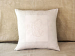 An antique French linen monogrammed 50cm square cushion - initials RC