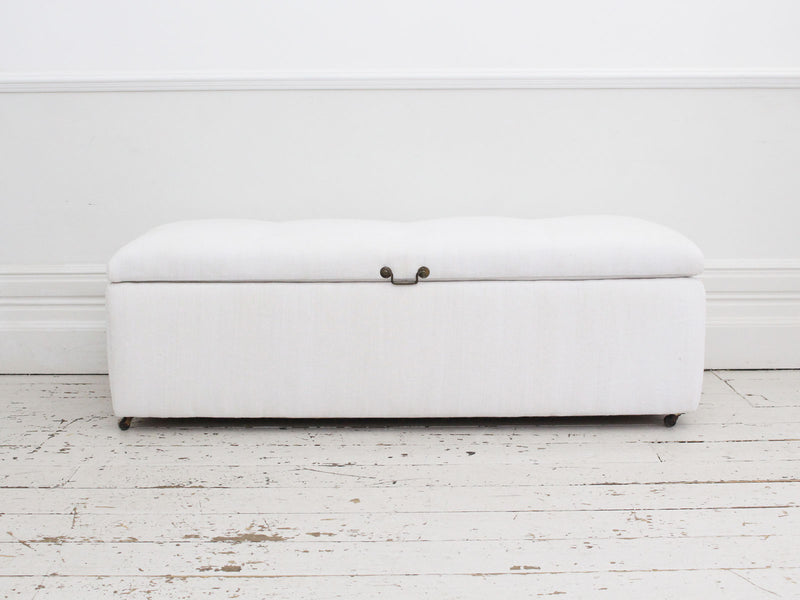 A 19th Century French Ottoman with Antique White Linen Covering