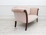 A Sabre Legged Regency Sofa Upholstered in Pale Blush Velvet