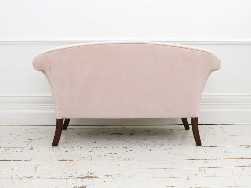 A Sabre Legged Regency Sofa Upholstered in Pale Blush Velvet