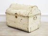 A Vintage Light Ivory Metal Trunk with Scalloped Top and Blue Interior