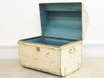 A Vintage Light Ivory Metal Trunk with Scalloped Top and Blue Interior