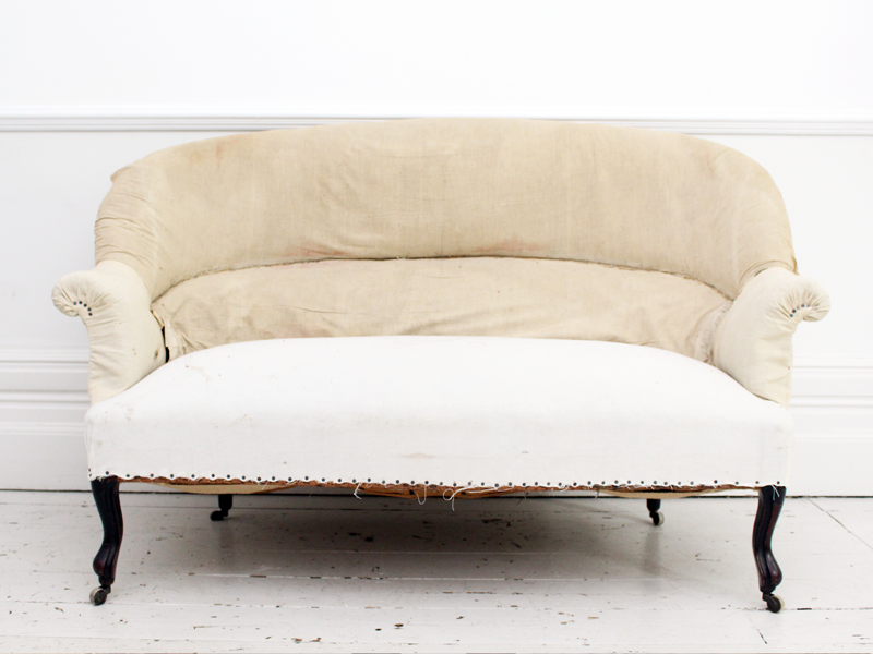 An Antique French 19th Century Sofa with Curved Back