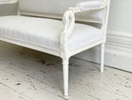 A Charles X Painted White Sofa with Swan Head Carving