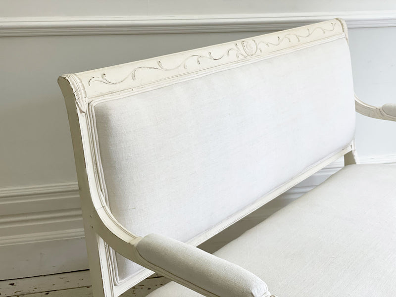 A Charles X Painted White Sofa with Swan Head Carving