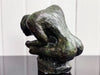 A Bronze Sculpture of a Crouching Woman