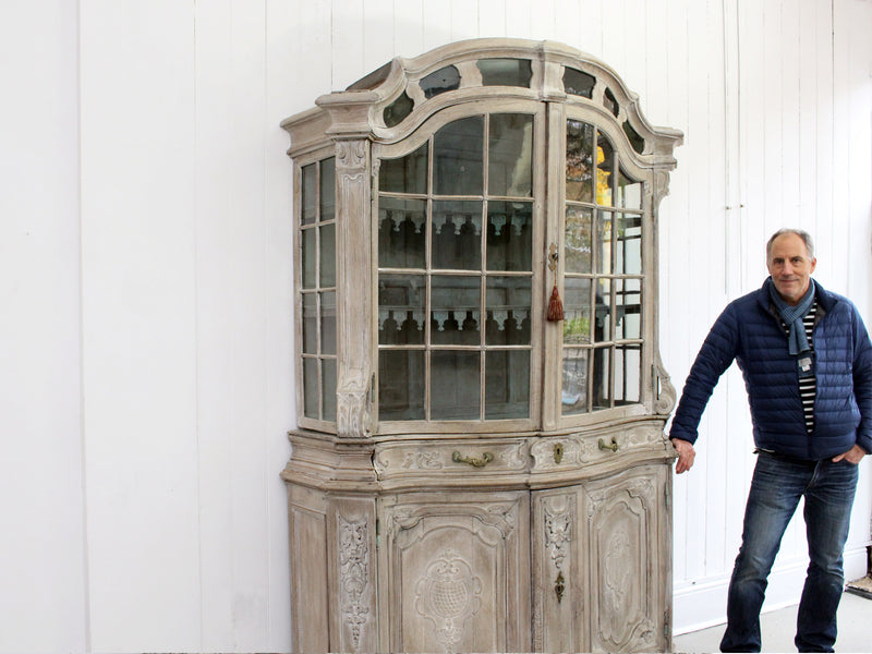 An 18th Century Limed Oak Serpentine Fronted Bruges Vitrine with Pale Blue Interior