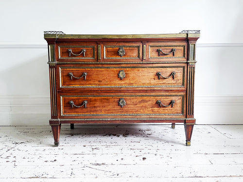A Majestic Louis XVI Mahogany and Brass Commode
