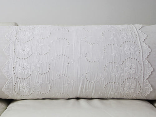 Antique French scalloped lace on linen bolster by Charlotte Casadéjus