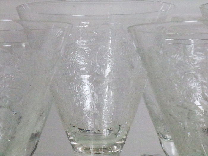 A beautiful set of 8 French etched champagne and wine glasses