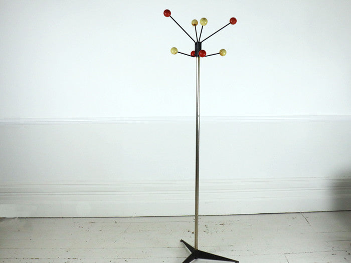 A 1950's atomic coat stand with tripod base
