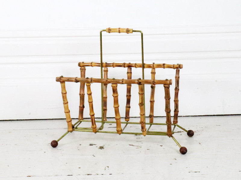 A 1960's bamboo and brass magazine rack