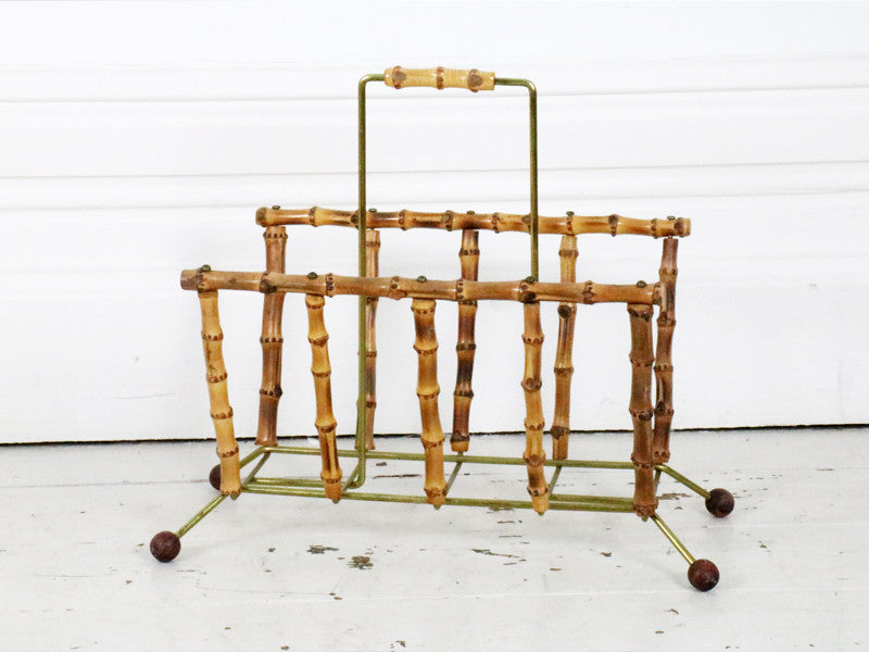 A 1960's bamboo and brass magazine rack
