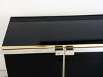 A 1970's Maison de Lancel black and gold sideboard