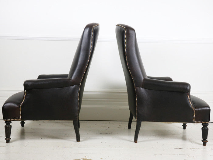 A pair of leather Napoleon III French library armchairs