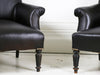 A pair of leather Napoleon III French library armchairs