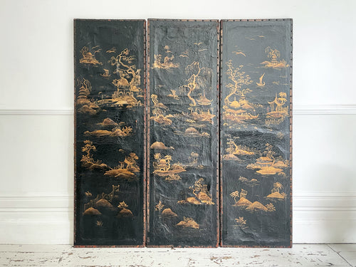 A Three Panel 18th Century Chinoiserie Leather Screen with Gilt Decoration