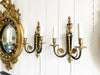 A Pair of 1950's Empire Style French Two Light Gilt Bronze Sconces