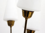 A 1950's French Five Arm Brass Standing Lamp with Opaque Glass shades