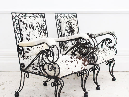 A Pair of 1950's French Cowhide Wrought Iron Armchairs