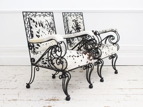 A Pair of 1950's French Cowhide Wrought Iron Armchairs