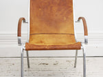 A 1970's Tan Leather & Aluminium Armchair in the manner of Rudolf Szedleczky
