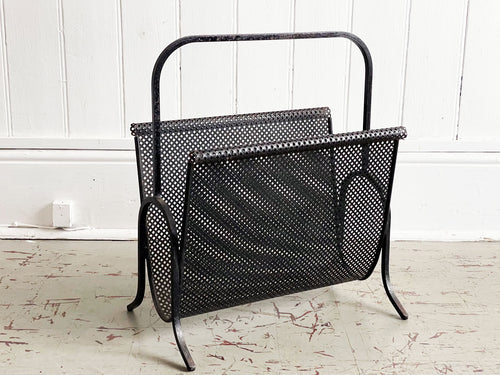 A Sculptural 1950's French Perforated Polychrome Metal Magazine Rack