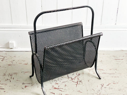 A Sculptural 1950's French Perforated Polychrome Metal Magazine Rack