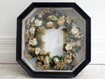 A Very Large Napoleon III Black Vitrine Frame with Flower Couronne