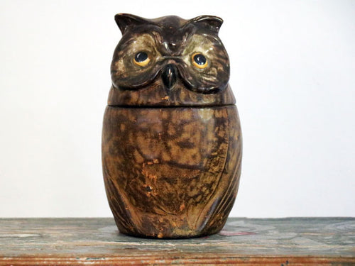A French ceramic and leather owl cookie jar